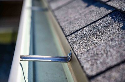 freshlook Close-up of a clean and empty roof gutter in Kirkland, showcasing the results of professional gutter cleaning Kirkland services to prevent water damage and ensure proper drainage.
